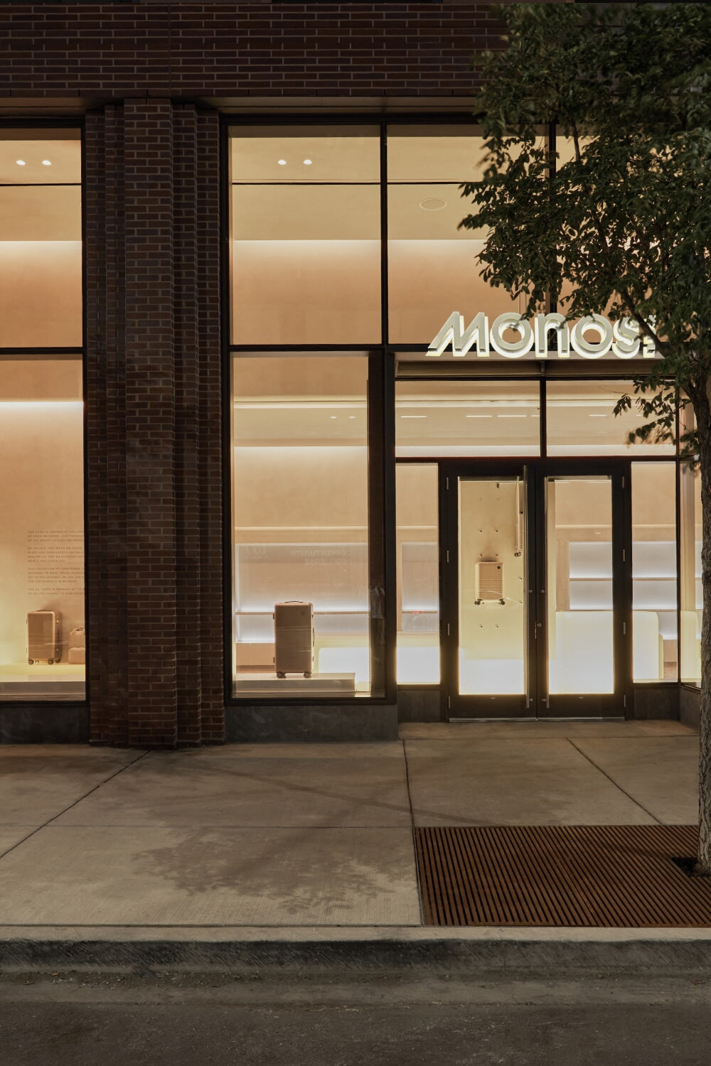 Modern building facade with glass windows and a visible brand logo.